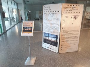 Exposició "Banca Armada. Negoci a les fronteres : militarització dels espais migratoris"